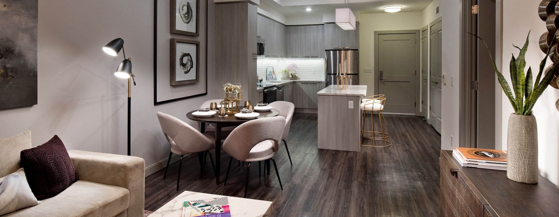 a living room with a dining table and a couch