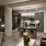 a kitchen and a living room with a couch and a table