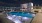 a swimming pool with chairs around it