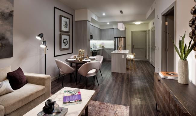 Wide open living areas flooded with natural light a living room with a dining table and a couch