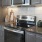 a kitchen with black appliances