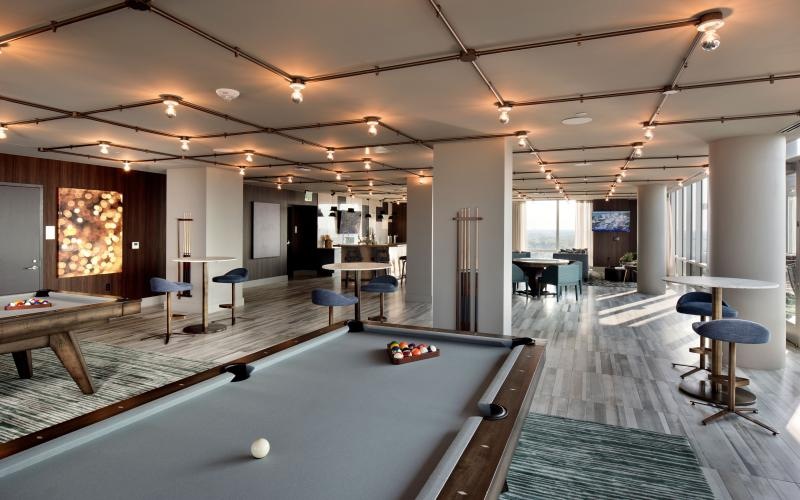 a pool table in a clubhouse room